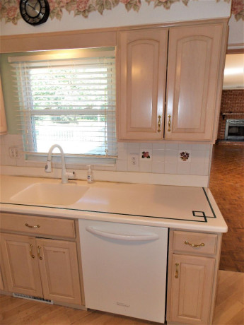 bleached-oak-kitchen-cabinets-all-appliances-and-corian-counter-tops-big-2