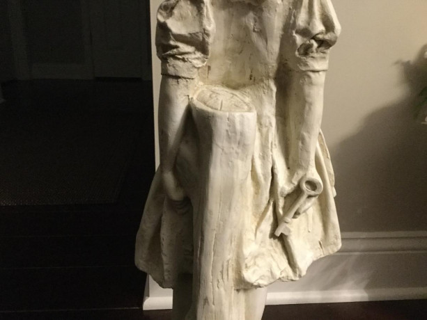 statue-of-young-girl-on-a-rock-holding-a-key-big-1