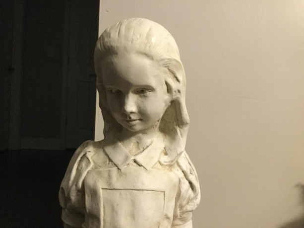 statue-of-young-girl-on-a-rock-holding-a-key-big-3