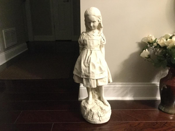 statue-of-young-girl-on-a-rock-holding-a-key-big-4