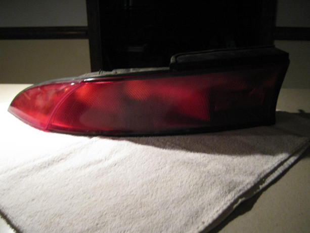 like-new-9899-mitsubishi-eclipse-spyder-tail-lights-big-1